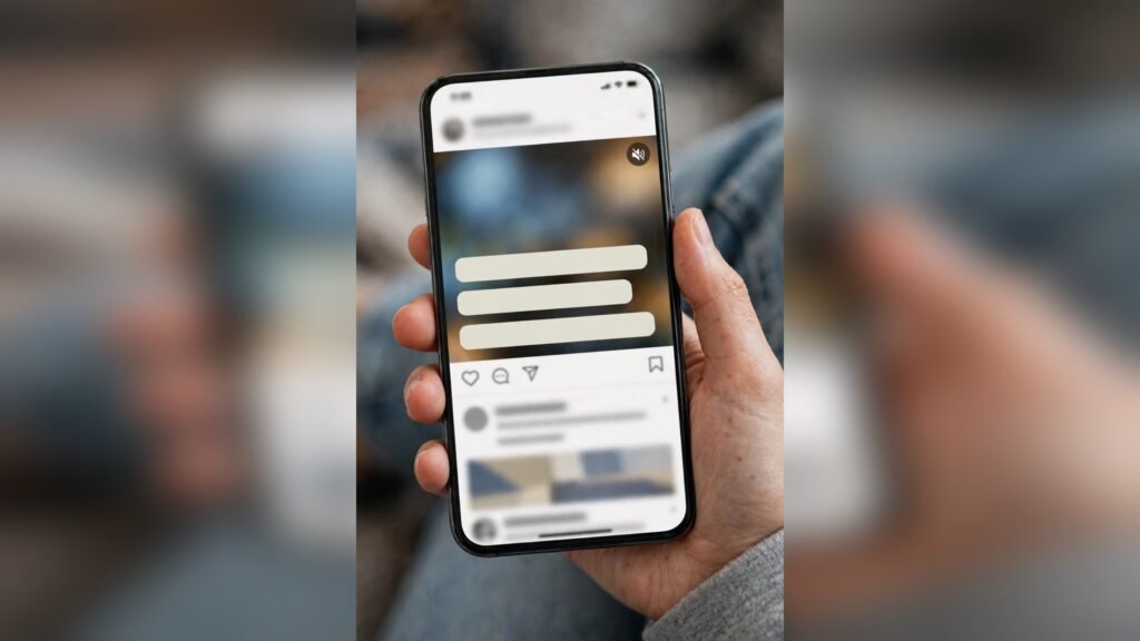 Phone scrolling a social feed with a captioned video on mute